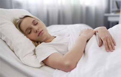 Young Woman Sleeping in Bed Young Woman Sleeping in Bed